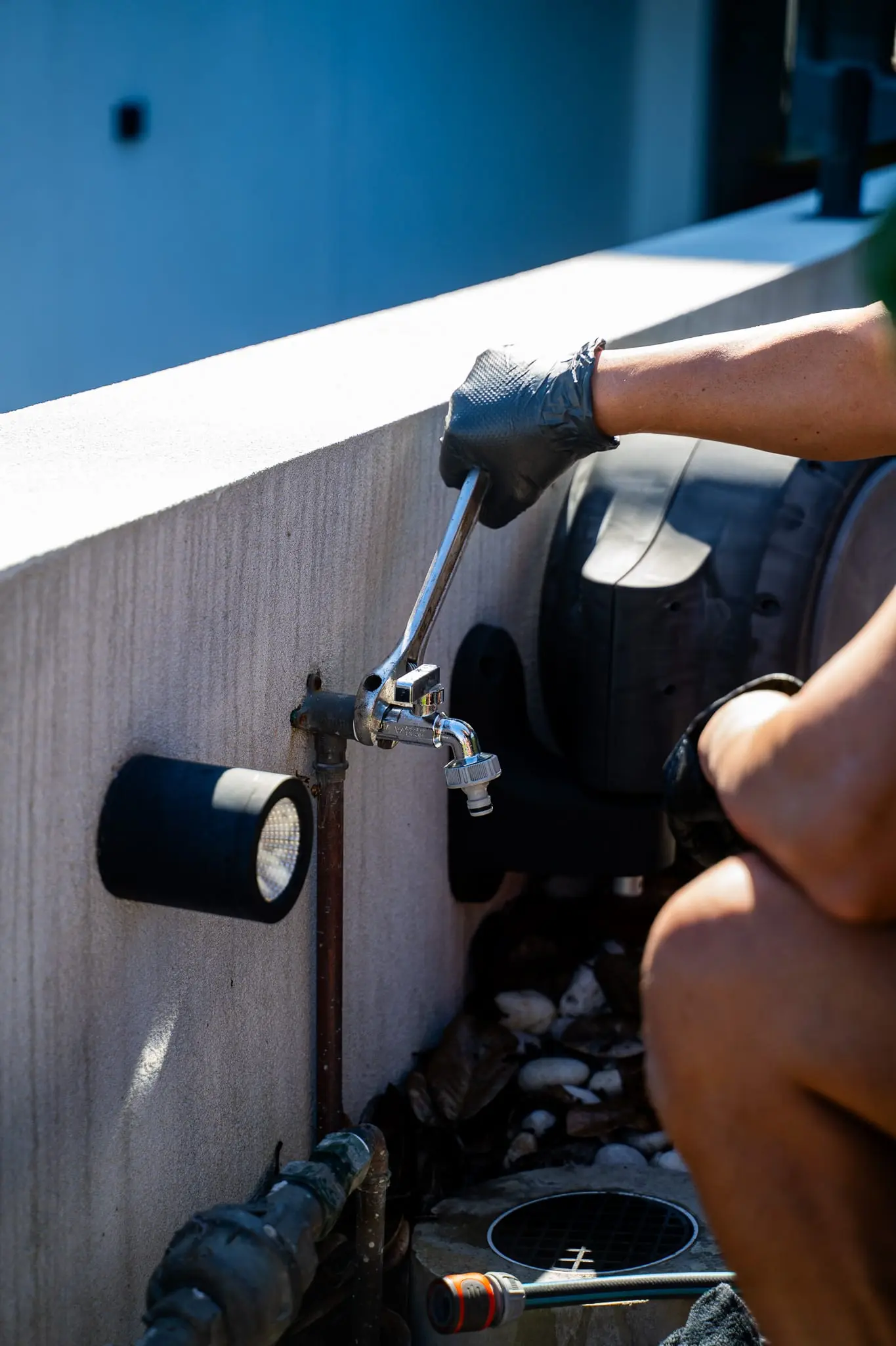 Close-up of a spanner on an outdoor garden tap