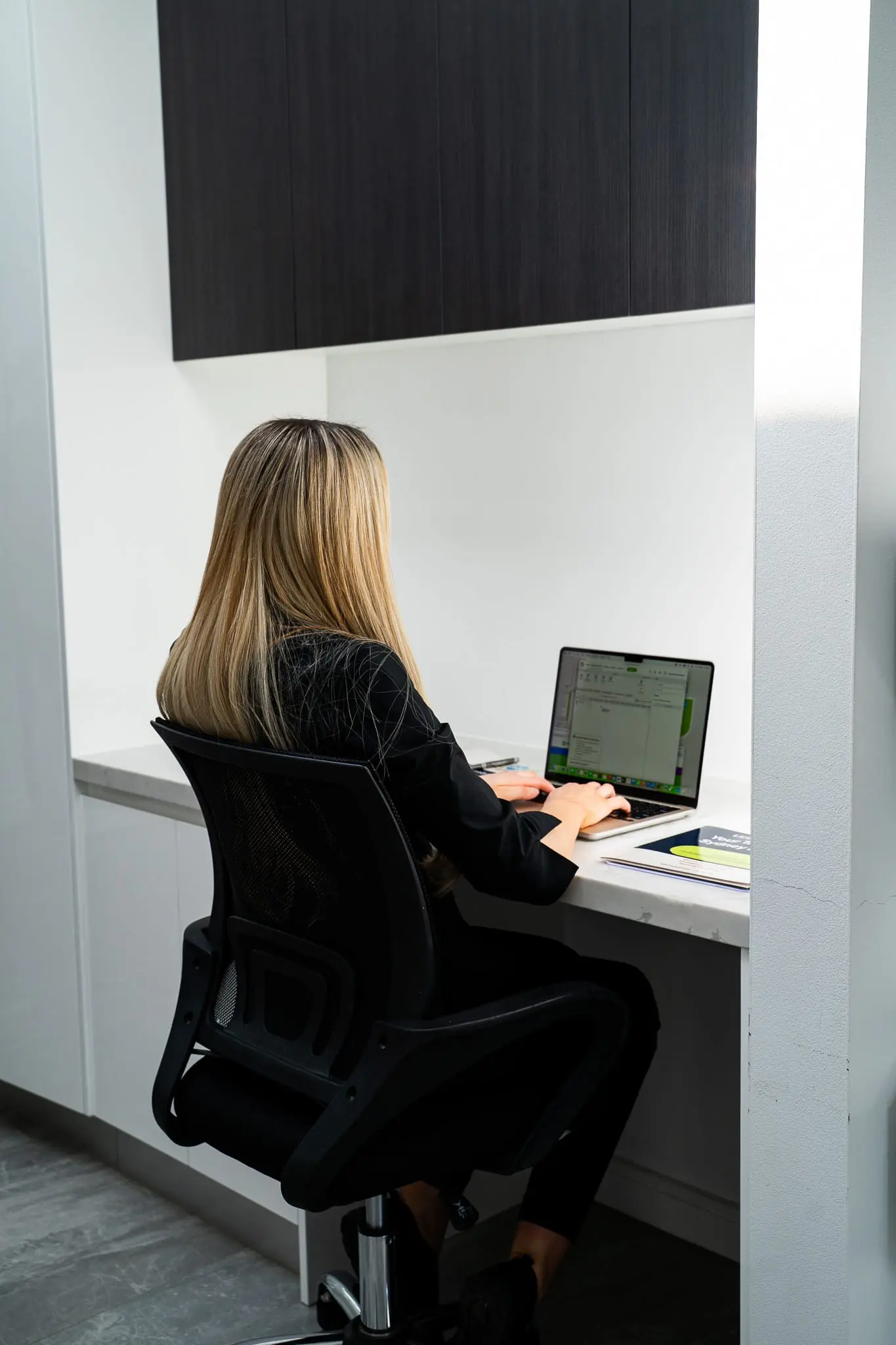 Mr Flow Plumbing team member working at the office desk