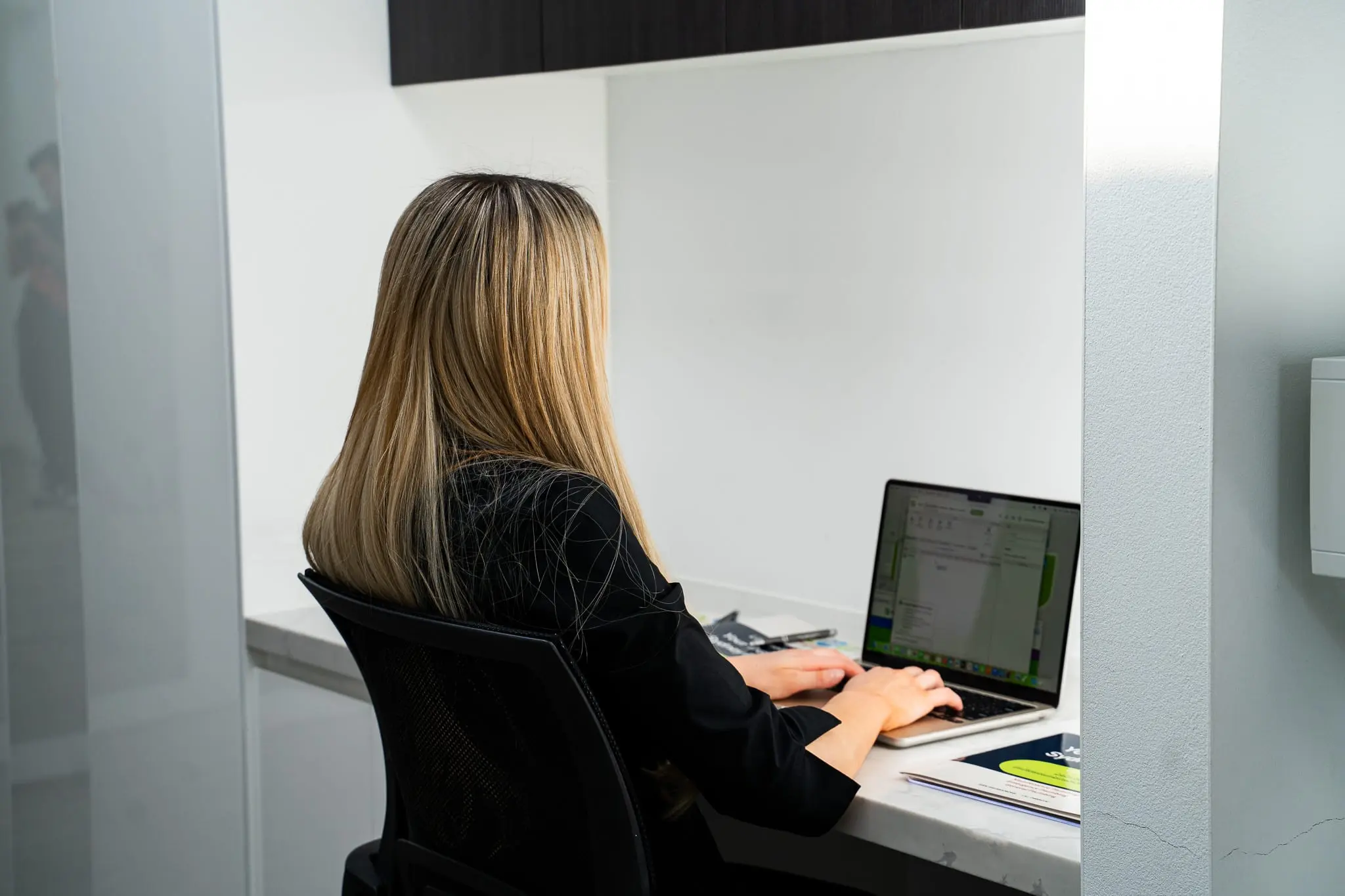 Mr Flow Plumbing team member at the office desk