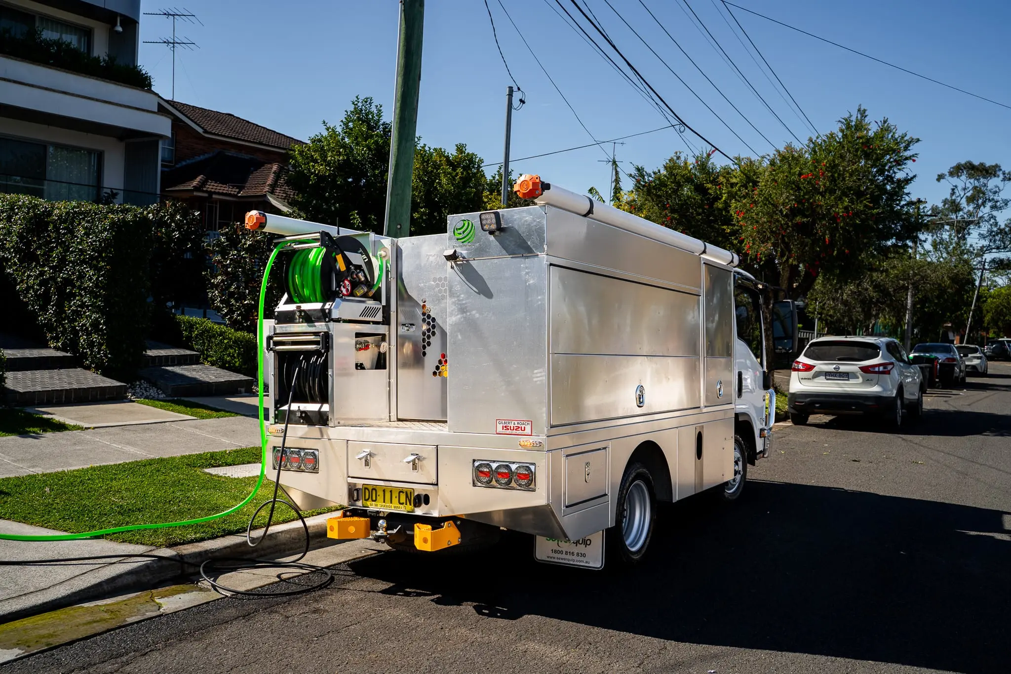 Rear of the Mr Flow service truck with the high-pressure drain jetter hose reel